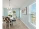 Dining area bathed in natural light, complemented by a round table and inviting decor at 4987 Belted Kingfisher Dr, Oxford, FL 34484