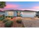 Charming single-story home featuring a brick driveway, two-car garage, and beautifully landscaped front yard at 4987 Belted Kingfisher Dr, Oxford, FL 34484