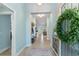 Spacious foyer with tile flooring, view of the living room, and decorative accents at 4987 Belted Kingfisher Dr, Oxford, FL 34484