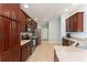 Bright kitchen featuring stainless steel appliances, ample storage, and lots of countertop space at 4987 Belted Kingfisher Dr, Oxford, FL 34484