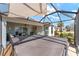 View of a lanai featuring a hot tub, patio furniture, and sun shade at 4987 Belted Kingfisher Dr, Oxford, FL 34484