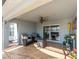 A cozy lanai with tiled flooring, comfortable seating, and sliding glass doors at 4987 Belted Kingfisher Dr, Oxford, FL 34484