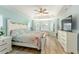Well-lit main bedroom, with a tray ceiling and a lovely view from the windows at 4987 Belted Kingfisher Dr, Oxford, FL 34484