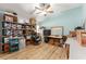 Storage room with hardwood floors and shelving at 4987 Belted Kingfisher Dr, Oxford, FL 34484