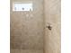 Close up of the tile work inside the walk in shower at 4987 Belted Kingfisher Dr, Oxford, FL 34484