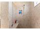 Walk-in shower with tiled walls and bench at 4987 Belted Kingfisher Dr, Oxford, FL 34484