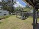 Outdoor patio area in backyard, perfect for entertaining, with a grill and festive decorations at 504 Se 35Th Ave, Ocala, FL 34471