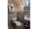 This bathroom features tile walls, updated sink, toilet and fixtures at 504 Se 35Th Ave, Ocala, FL 34471