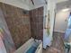 Features a bathtub with tiled walls and modern fixtures, plus a view into the adjoining bedroom at 504 Se 35Th Ave, Ocala, FL 34471