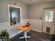 Cozy dining area featuring a wooden table and chairs and a glass door with pet entrance at 504 Se 35Th Ave, Ocala, FL 34471