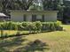 View of house with green wall of vines and flowers at 504 Se 35Th Ave, Ocala, FL 34471