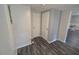 Hallway featuring wood floors, two doors and pale gray walls at 504 Se 35Th Ave, Ocala, FL 34471