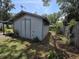 Exterior of outbuilding with double doors, offering practical storage and workspace at 504 Se 35Th Ave, Ocala, FL 34471