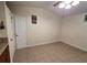 Room with tile flooring, ceiling fan, and door leading to additional space at 504 Se 35Th Ave, Ocala, FL 34471