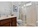 Bathroom featuring a glass-enclosed shower and a modern vanity sink at 5241 Oakbourne Ave, Davenport, FL 33837