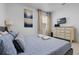 Cozy bedroom with a soft, comfortable bed and plenty of natural light at 5241 Oakbourne Ave, Davenport, FL 33837