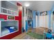 Themed bedroom featuring bunk beds, play area, and imaginative decor creates a fun and adventurous atmosphere at 5241 Oakbourne Ave, Davenport, FL 33837