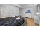Comfortable bedroom with a bed, bright white dresser, and light-colored wood flooring at 5241 Oakbourne Ave, Davenport, FL 33837