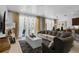 Open living space features tile floors, modern furniture, and plenty of natural light at 5241 Oakbourne Ave, Davenport, FL 33837