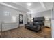 Spacious bedroom featuring modern decor, a plush bed, and a sitting area, creating a comfortable and stylish retreat at 5241 Oakbourne Ave, Davenport, FL 33837