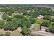 Aerial view of a private home site surrounded by a canopy of mature trees showcasing peaceful and natural surroundings at 5380 County Road 122, Wildwood, FL 34785