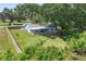 Aerial view shows the large property and the outdoor features including a bar and patio at 5380 County Road 122, Wildwood, FL 34785