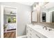 Bathroom with dual sinks, quartz countertops, and stylish fixtures at 5380 County Road 122, Wildwood, FL 34785