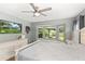 Bedroom with bay window and mounted television at 5380 County Road 122, Wildwood, FL 34785