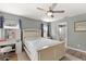 Cozy bedroom with a view of an ensuite bathroom and a large window at 5380 County Road 122, Wildwood, FL 34785