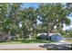 Charming single-Gathering home with mature trees and blue paint at 5380 County Road 122, Wildwood, FL 34785