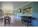 The patio features a built in blackstone grill and television for outdoor entertaining and leisure at 5380 County Road 122, Wildwood, FL 34785