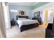 Comfortable bedroom with carpet flooring, a king-sized bed, and a dresser at 5437 Compass Pt # 00, Oxford, FL 34484