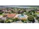 Aerial view of the community featuring a large pool, clubhouse, and beautiful landscaping at 5437 Compass Pt # 00, Oxford, FL 34484
