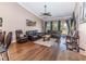 Comfortable living room with hardwood floors, a ceiling fan, and ample seating with an open view at 5437 Compass Pt # 00, Oxford, FL 34484