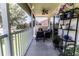 Relax on this screened patio with comfortable seating and potted plants at 5437 Compass Pt # 00, Oxford, FL 34484