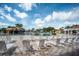 Inviting community pool area with lounge chairs, perfect for soaking up the sun at 5437 Compass Pt # 00, Oxford, FL 34484