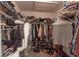 Spacious walk-in closet with ample storage for clothing and shoes at 5437 Compass Pt # 00, Oxford, FL 34484
