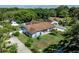 Lovely single-story home featuring a well-maintained lawn and mature landscaping at 5521 Oak St, Mount Dora, FL 32757