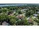 Panoramic aerial view of a neighborhood surrounded by lush greenery at 5521 Oak St, Mount Dora, FL 32757
