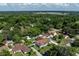 Expansive aerial view of a residential area surrounded by lush green trees at 5521 Oak St, Mount Dora, FL 32757