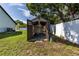 View of a backyard storage shed with open doors, providing additional storage options at 5521 Oak St, Mount Dora, FL 32757