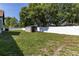 Backyard showcasing a storage shed and white fencing at 5521 Oak St, Mount Dora, FL 32757