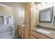 The bathroom offers double sinks, a vanity, and a linen closet at 5521 Oak St, Mount Dora, FL 32757