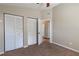 Cozy bedroom features carpet flooring and double door closets for ample storage at 5521 Oak St, Mount Dora, FL 32757