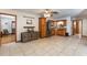 Open living area featuring tile flooring, wood cabinets, and stainless steel appliances at 5521 Oak St, Mount Dora, FL 32757