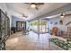 Large, bright sunroom with three ceiling fans, tile flooring and access to the backyard at 5521 Oak St, Mount Dora, FL 32757