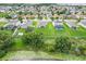 Panoramic aerial view of a community showcasing well-maintained homes and verdant lawns, offering a serene living environment at 641 Black Eagle Dr, Groveland, FL 34736