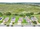 This scenic aerial view reveals a vibrant residential area neighboring a lush conservation area with a waterway at 641 Black Eagle Dr, Groveland, FL 34736