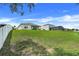 This home has a large backyard and outdoor covered patio with views of the neighborhood at 641 Black Eagle Dr, Groveland, FL 34736