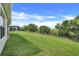 A spacious and well-maintained lawn behind the house creates a picturesque backyard at 641 Black Eagle Dr, Groveland, FL 34736